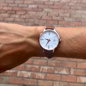 Gold watch with brown leather band